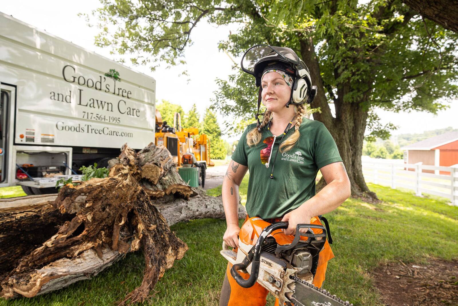 happy employee chainsaw tree removal woman goods 4
