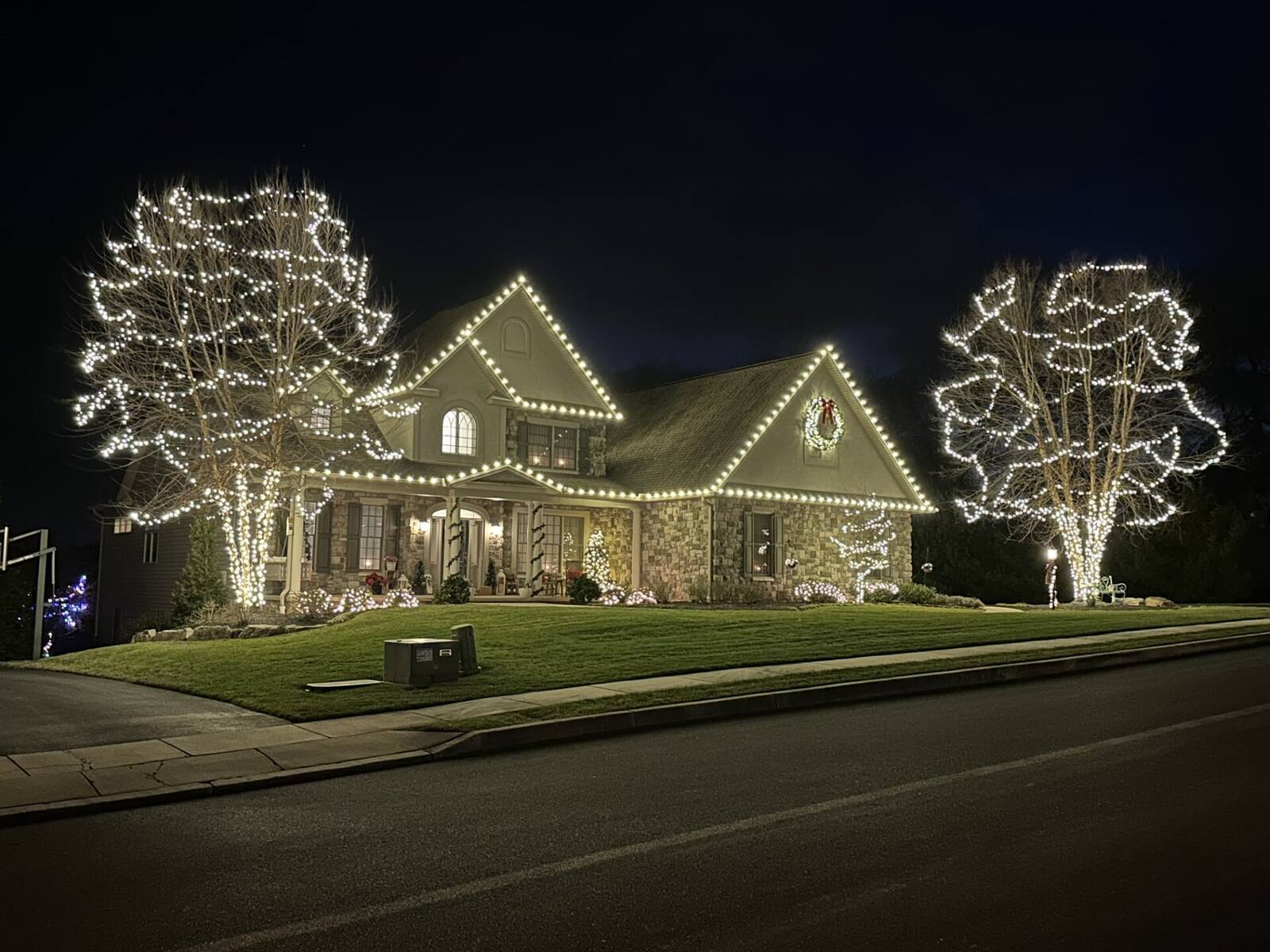 home lit up with christmas lights