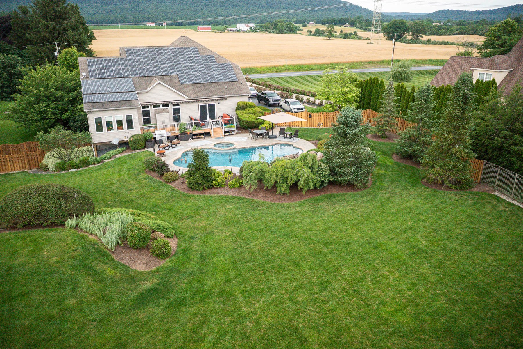 Aerial view of a Central PA property cared for by Good's, manicured lawn, sculpted beds, mature trees