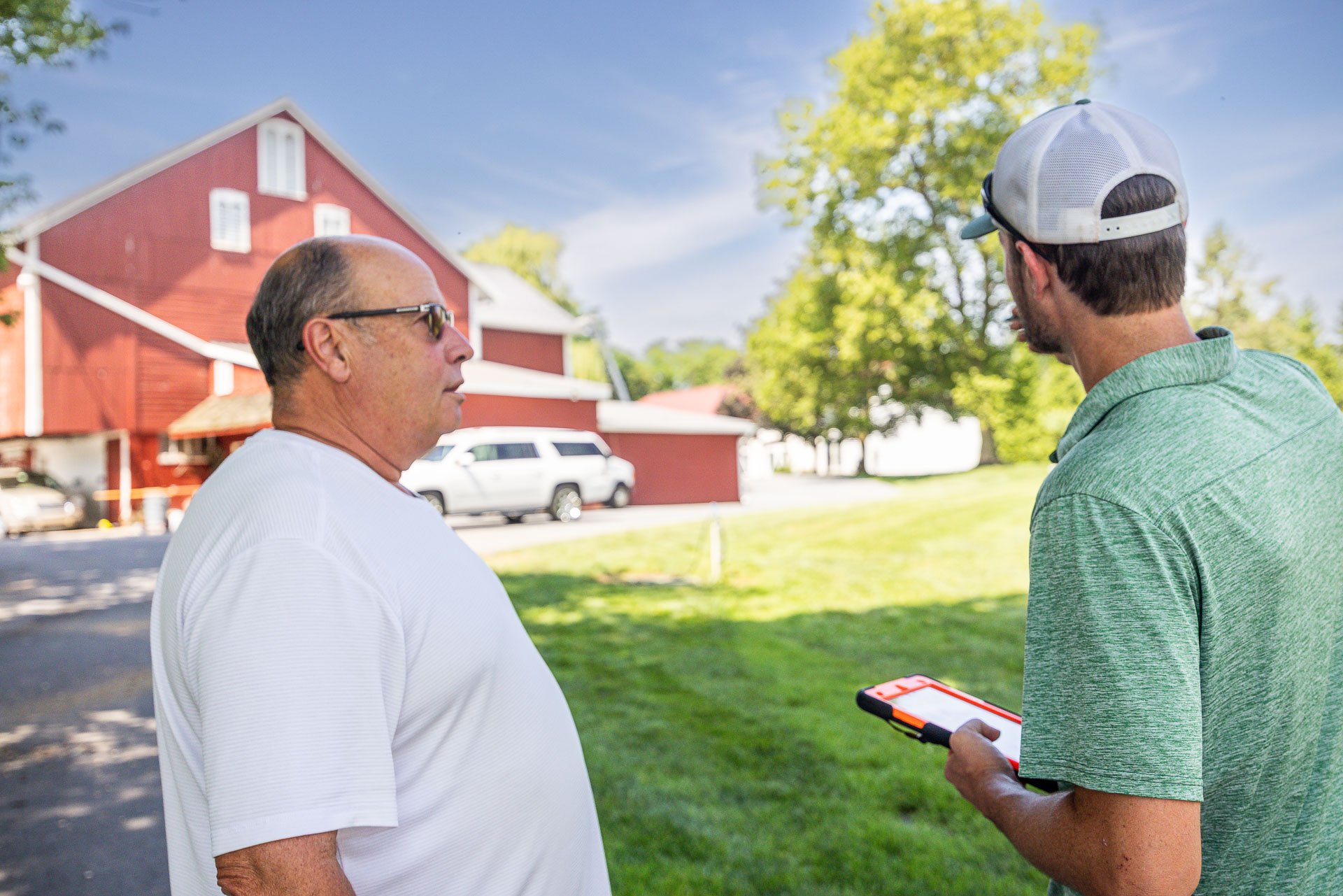arborist reviewing what pruning a tree needs