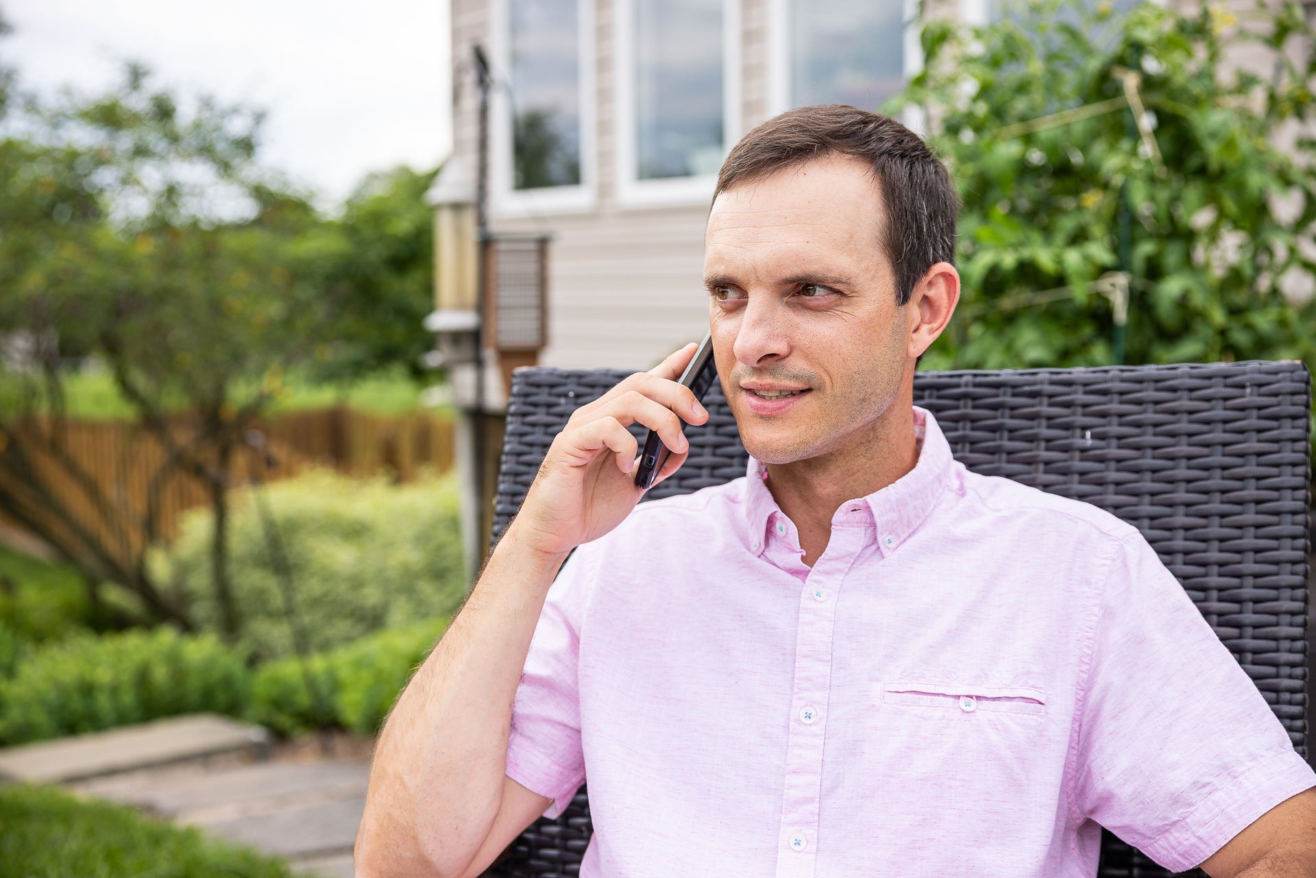 homeowner calling a tree service for storm damaged branches