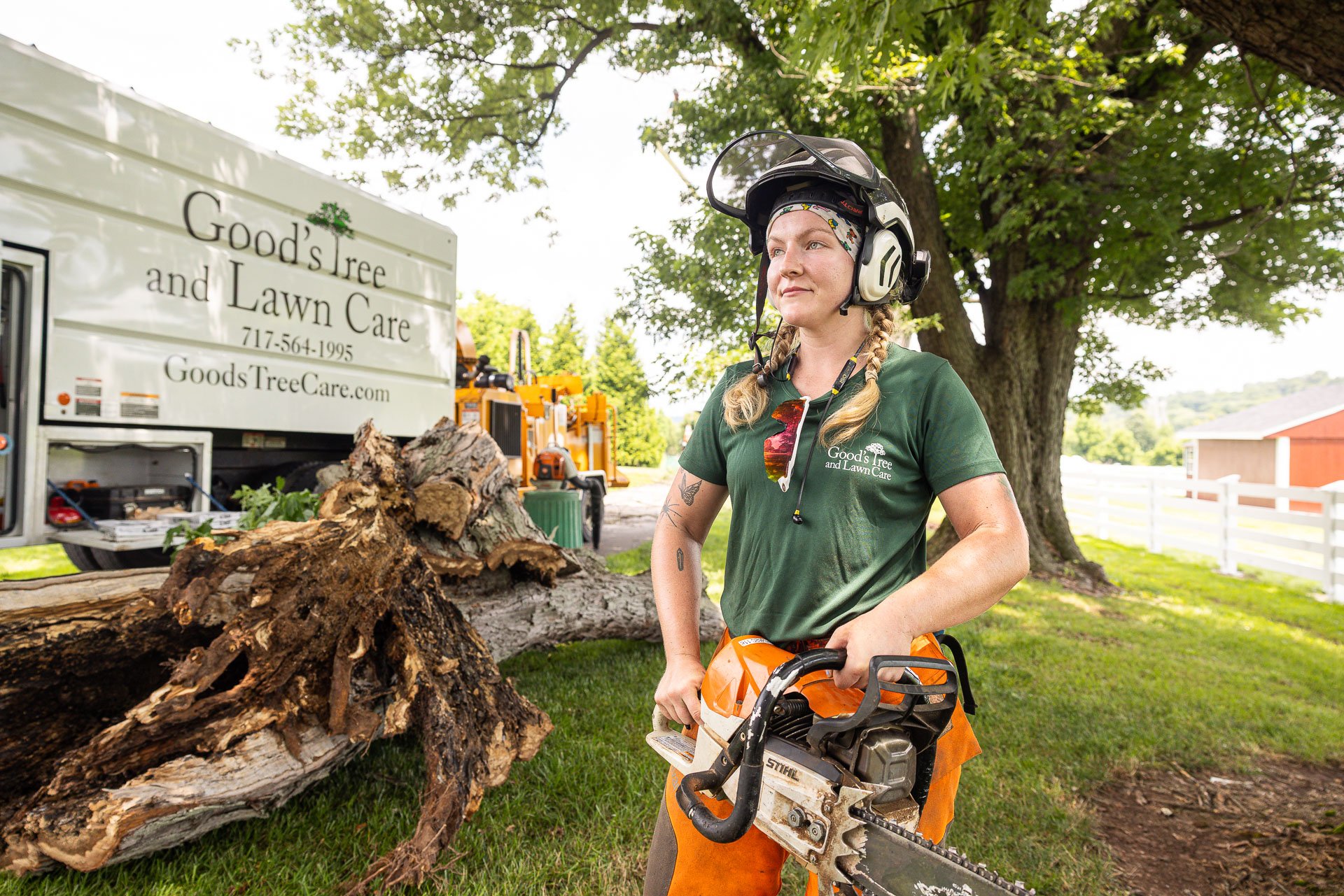 happy employee chainsaw tree removal woman goods 4