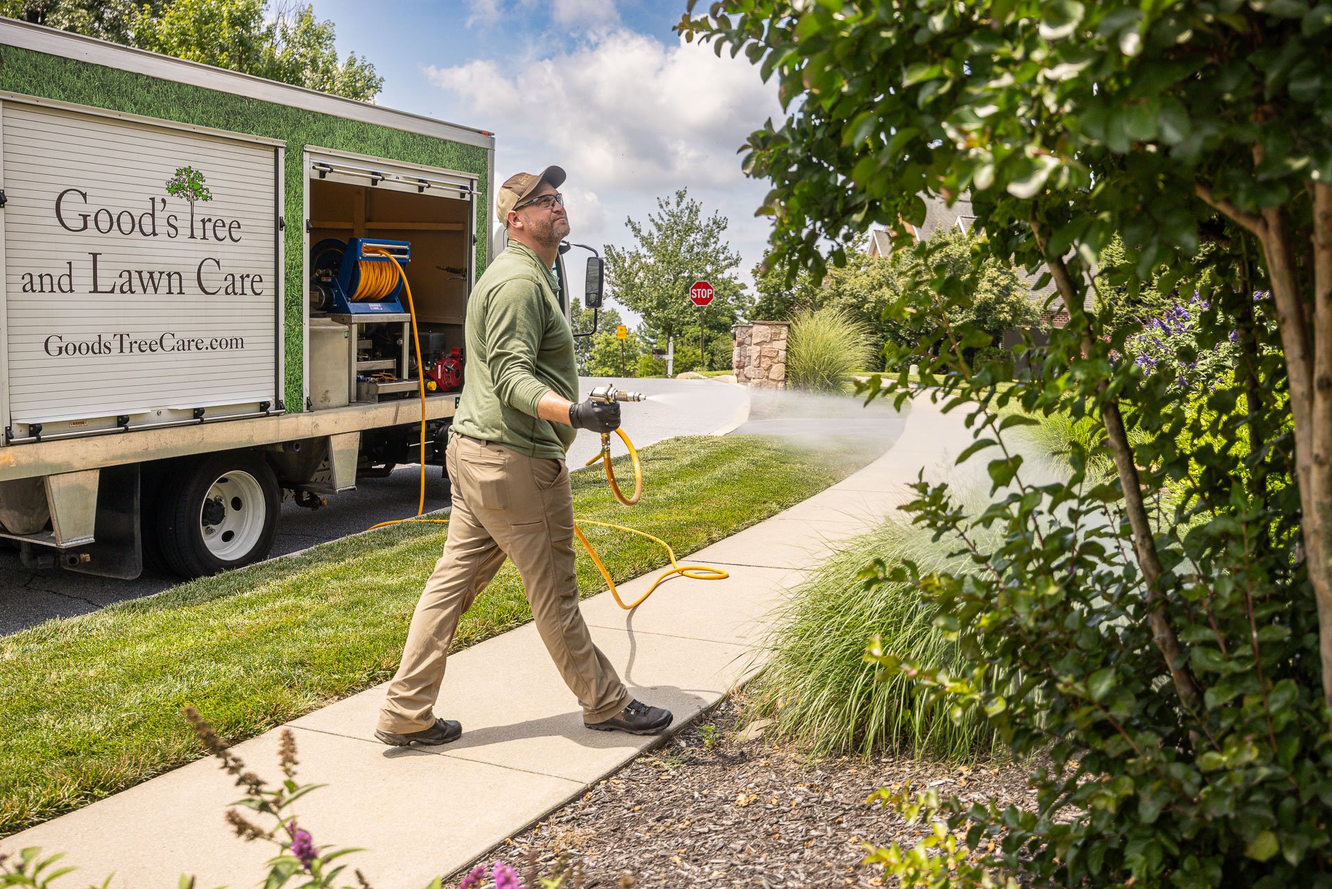 plant health care tech spraying shrubs trees 4
