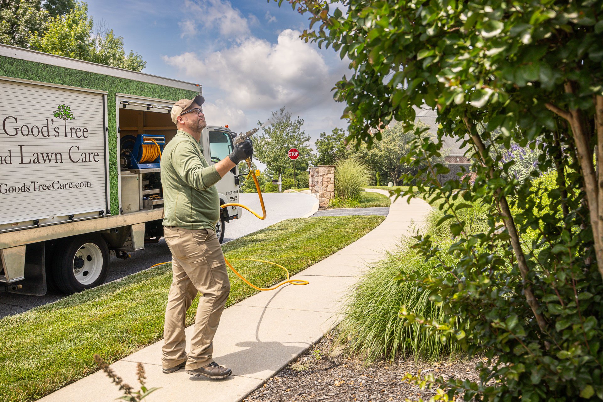plant health care tech spraying shrubs trees 5